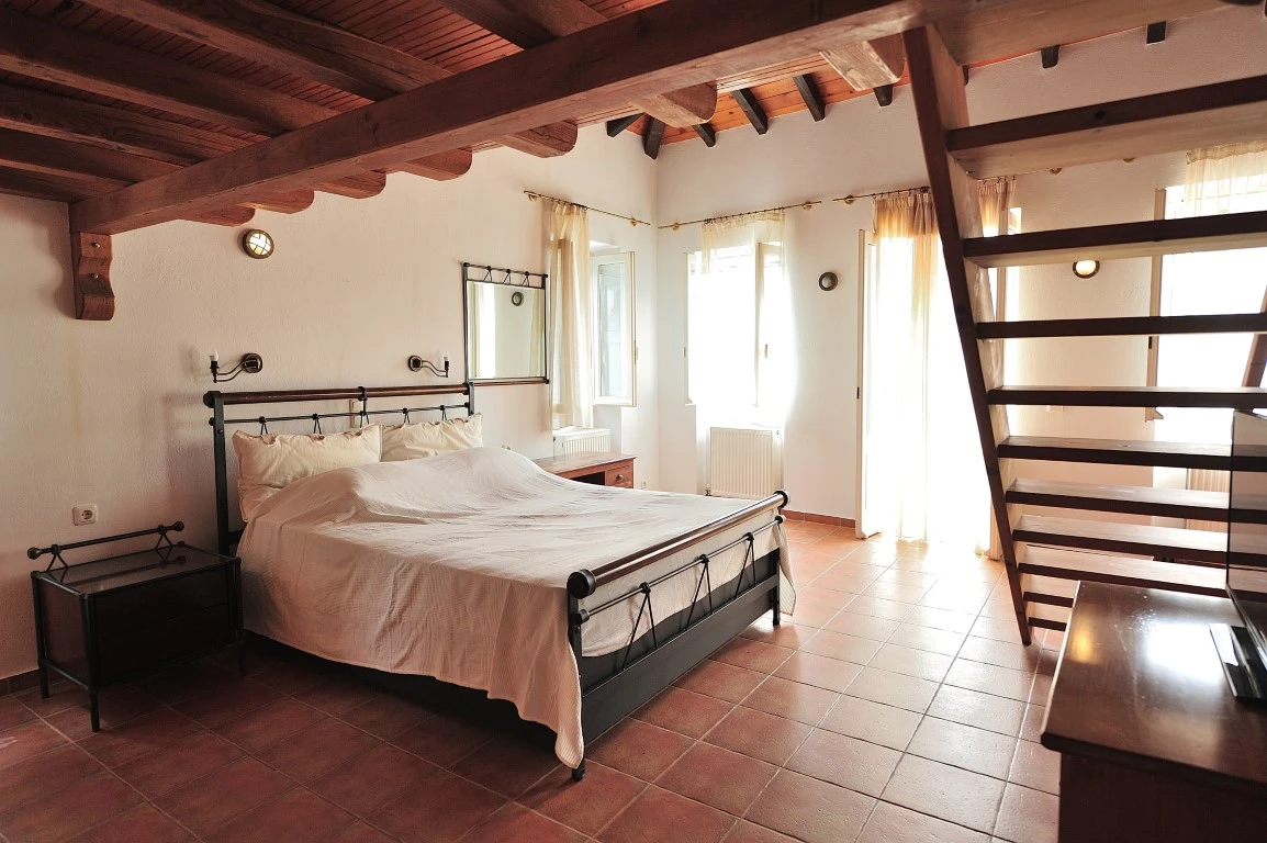 Choose between two stunning Skiathos locations: vibrant Skiathos Town at Orestis Mansion or the peaceful seaside setting of Orestis Suites in Kolios, designed to create a cosy and unforgettable Greek island escape.