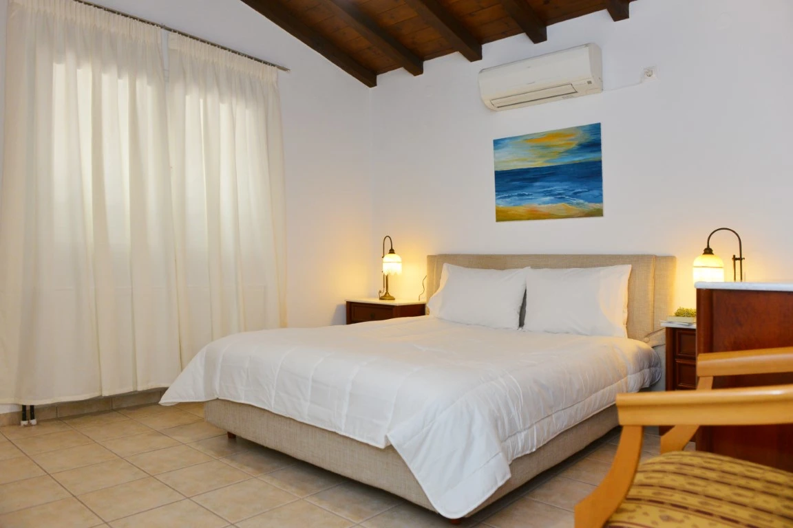 Choose between two stunning Skiathos locations: vibrant Skiathos Town at Orestis Mansion or the peaceful seaside setting of Orestis Suites in Kolios, designed to create a cosy and unforgettable Greek island escape.